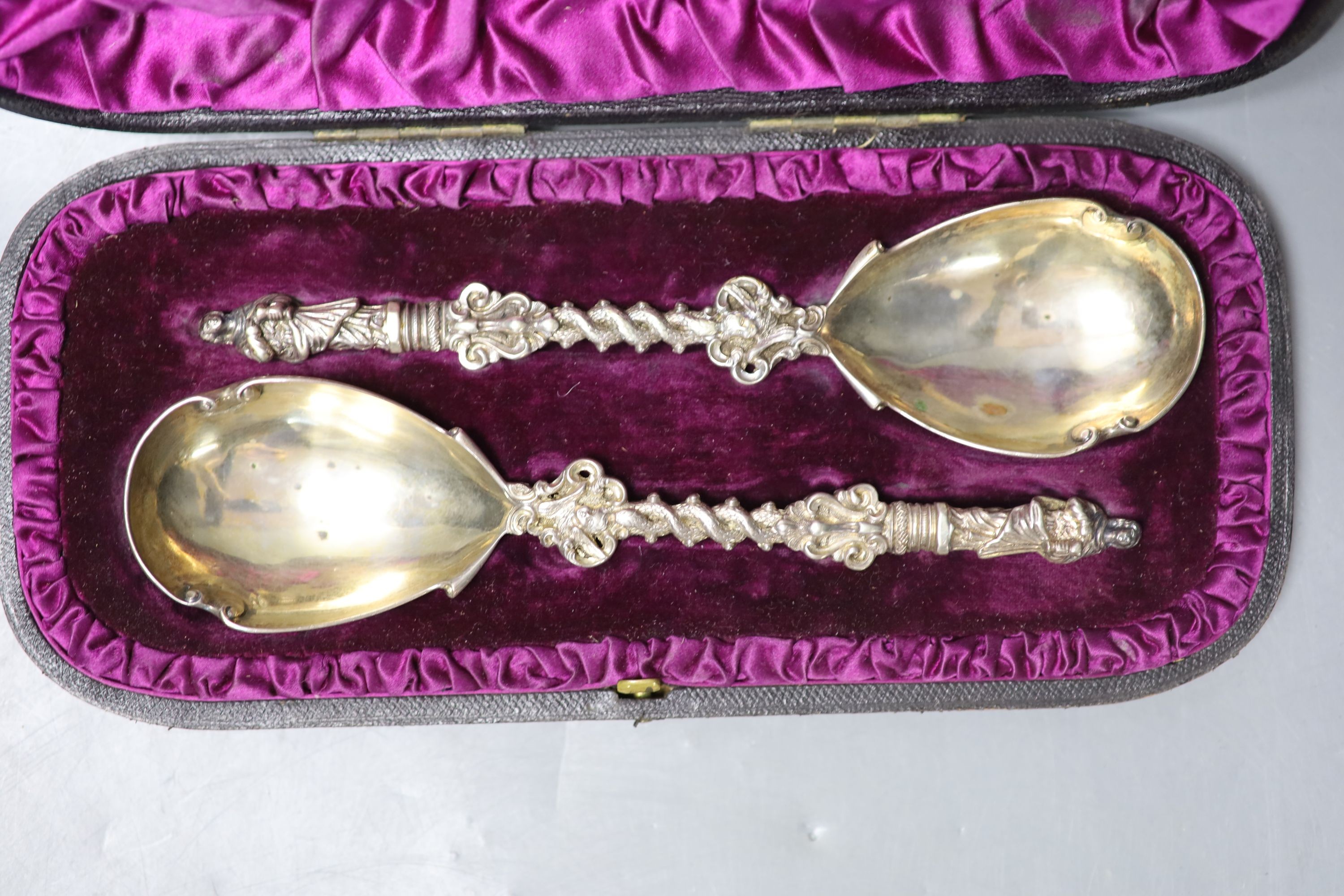 A cased pair of Victorian silver apostle spoons, Charles Boyton II, London, 1884, 20cm, 6oz.